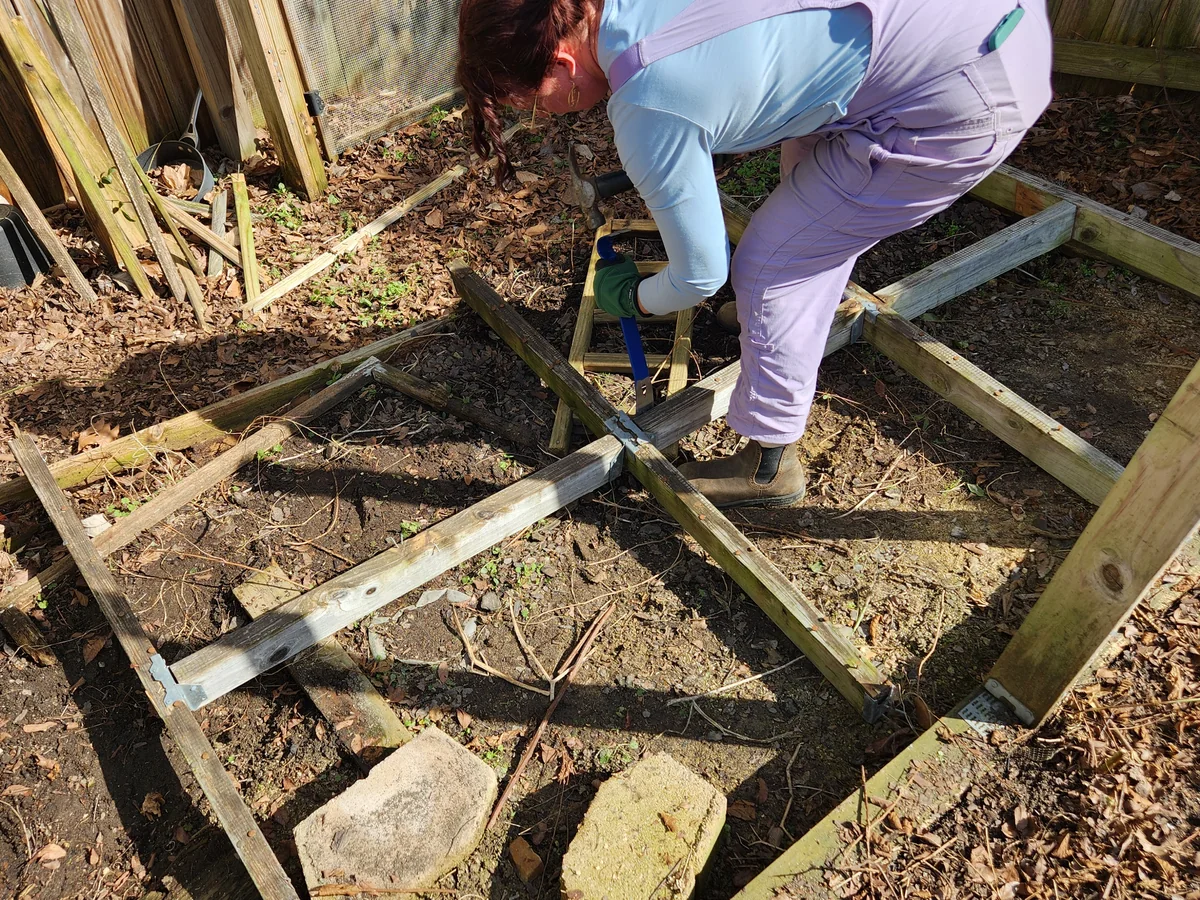 Katy reusing salvaged materials while working in a garden